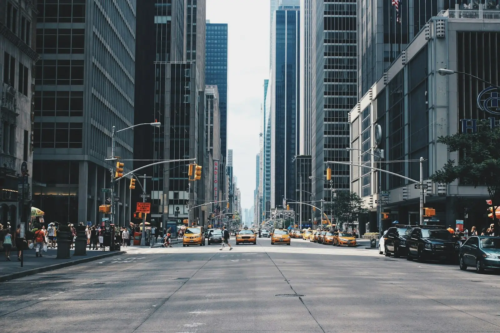 A busy city avenue lined with tall buildings